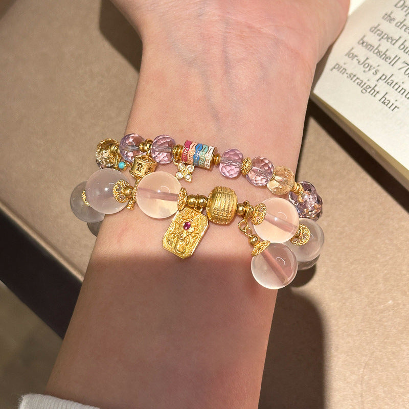 Golden Elephant Feng Shui Crystal Bracelet with rose quartz and amethyst, gold-plated elephant charm for wealth and love energy.